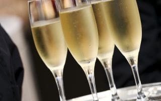 plate with 4 champagne glasses, beverage catering, event catering in Sydney